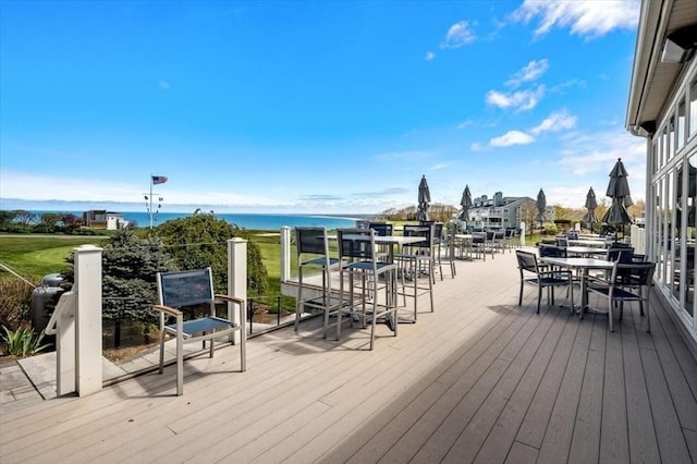 wooden deck with a water view