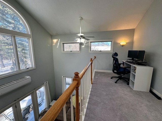 office area featuring baseboards, high vaulted ceiling, and light colored carpet