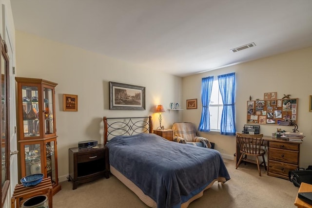 bedroom with light carpet