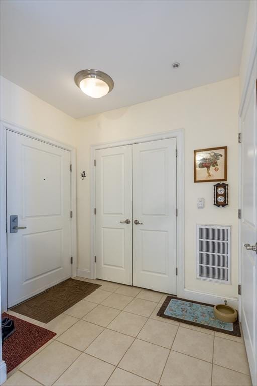 foyer with light tile patterned floors