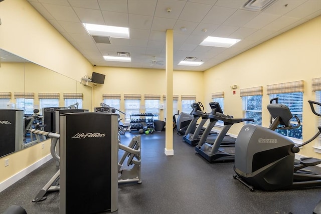 workout area featuring a drop ceiling