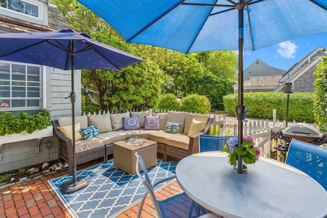 deck featuring grilling area, an outdoor hangout area, and a patio