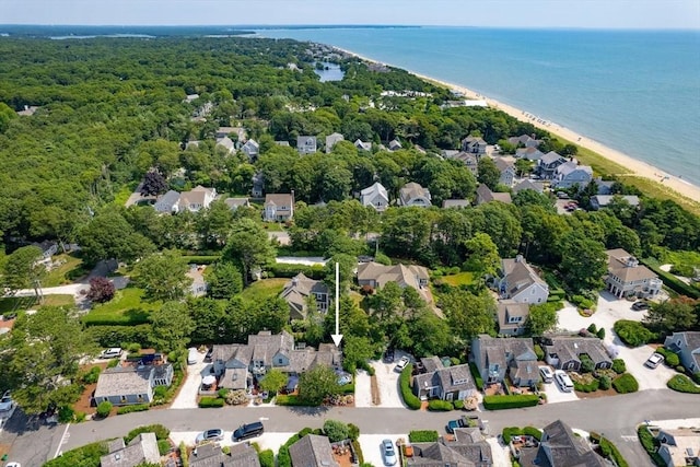 drone / aerial view featuring a water view and a view of the beach