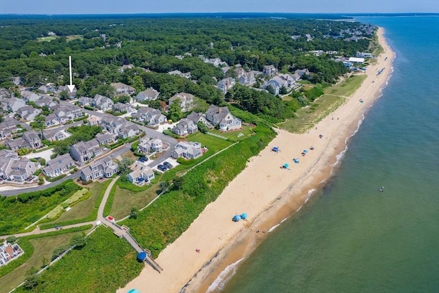 bird's eye view with a water view and a beach view