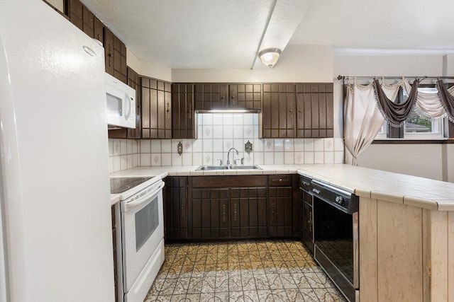 73 Biltmore St, Springfield, MA 01108 - kitchen with white appliances, tile countertops, a peninsula, and tasteful backsplash