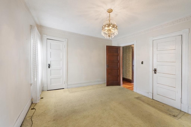 73 Biltmore St, Springfield, MA 01108 - carpeted empty room with crown molding and a chandelier