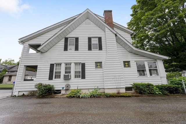 73 Biltmore St, Springfield, MA 01108 - view of home's exterior featuring a chimney and cooling unit