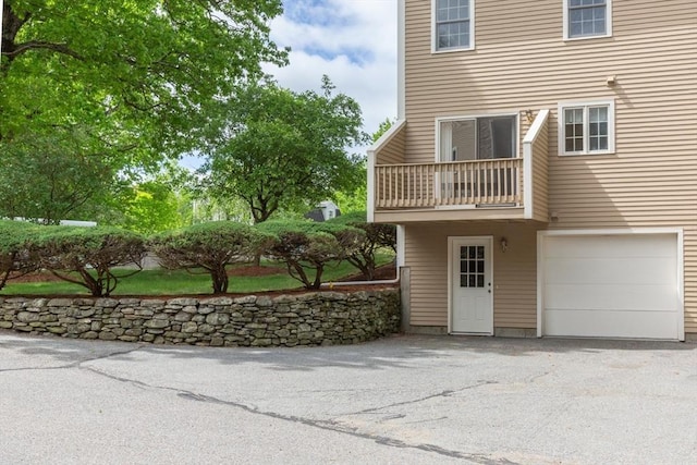 5 Brookfield Dr Unit B, Groton, MA 01450 - view of home's exterior with an attached garage, a balcony, and driveway