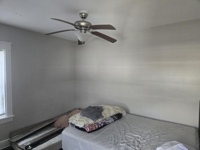 unfurnished bedroom featuring ceiling fan