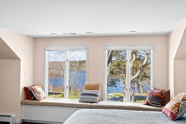 9 Lily Pond Ln, Cohasset, MA 02025 - bedroom with multiple windows, baseboard heating, and visible vents