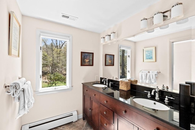 9 Lily Pond Ln, Cohasset, MA 02025 - full bathroom featuring visible vents, a sink, baseboards, and baseboard heating