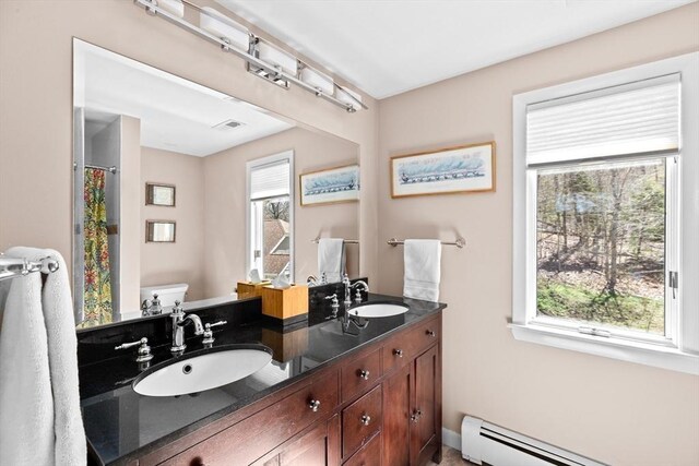 9 Lily Pond Ln, Cohasset, MA 02025 - full bath featuring toilet, a healthy amount of sunlight, a sink, and a baseboard radiator