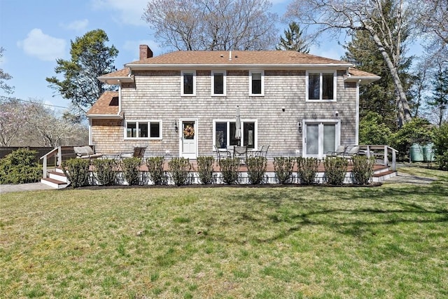 9 Lily Pond Ln, Cohasset, MA 02025 - back of property with a wooden deck, a yard, and a chimney