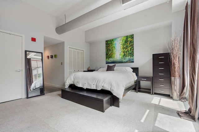 carpeted bedroom with a closet