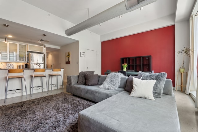 living room featuring concrete floors