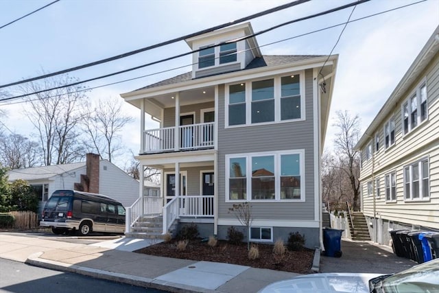 103-105 Neponset Ave, Boston, MA 02131 - traditional style home featuring a balcony, a porch, and stairway