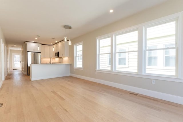 103-105 Neponset Ave, Boston, MA 02131 - unfurnished living room with light wood-style floors, plenty of natural light, and recessed lighting