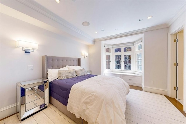 bedroom with light hardwood / wood-style floors and ornamental molding