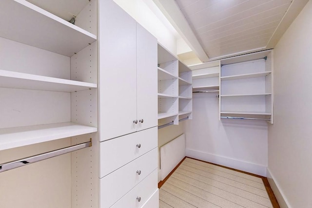 spacious closet featuring light hardwood / wood-style floors