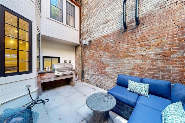 view of patio / terrace featuring an outdoor living space and grilling area