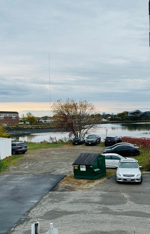 parking at dusk with a water view