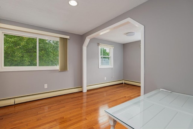 48 Rosemont St Unit 48, Haverhill, MA 01830 - unfurnished room with wood finished floors and a baseboard radiator