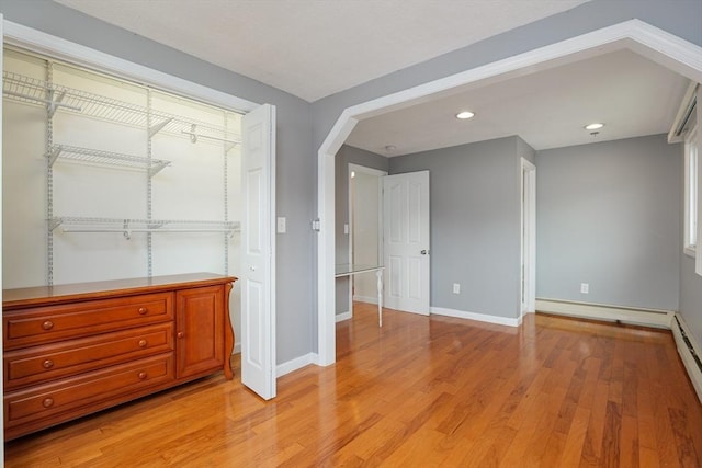 48 Rosemont St Unit 48, Haverhill, MA 01830 - unfurnished bedroom featuring light wood finished floors, recessed lighting, and arched walkways