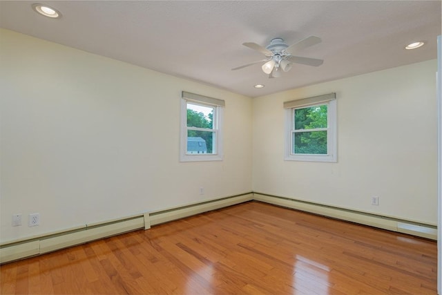 48 Rosemont St Unit 48, Haverhill, MA 01830 - empty room featuring wood finished floors, plenty of natural light, a ceiling fan, recessed lighting, and a baseboard radiator