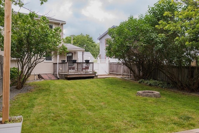 48 Rosemont St Unit 48, Haverhill, MA 01830 - fenced backyard with a deck and a fire pit