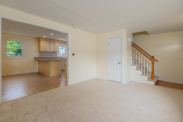 48 Rosemont St Unit 48, Haverhill, MA 01830 - unfurnished living room with light colored carpet, stairs, recessed lighting, and light tile patterned flooring