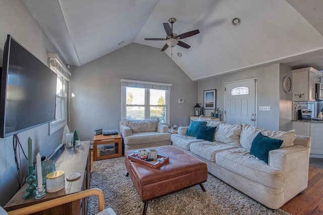 living room with vaulted ceiling, ceiling fan, and dark wood-type flooring