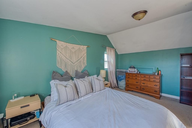 bedroom featuring carpet flooring and lofted ceiling