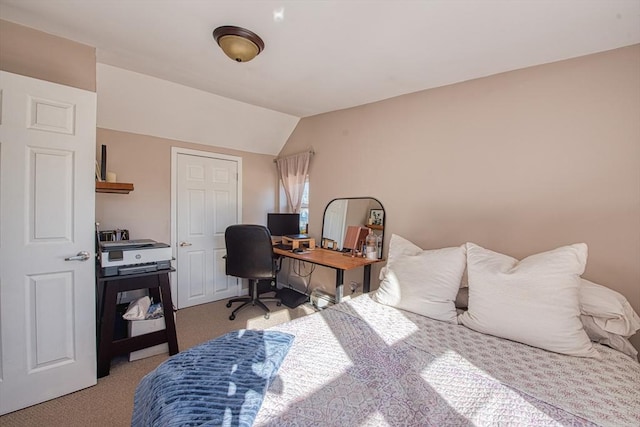 carpeted bedroom with vaulted ceiling