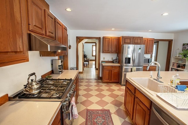 kitchen with appliances with stainless steel finishes and sink