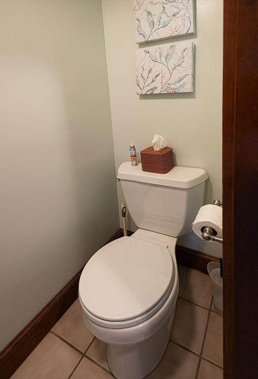 bathroom with tile patterned floors and toilet