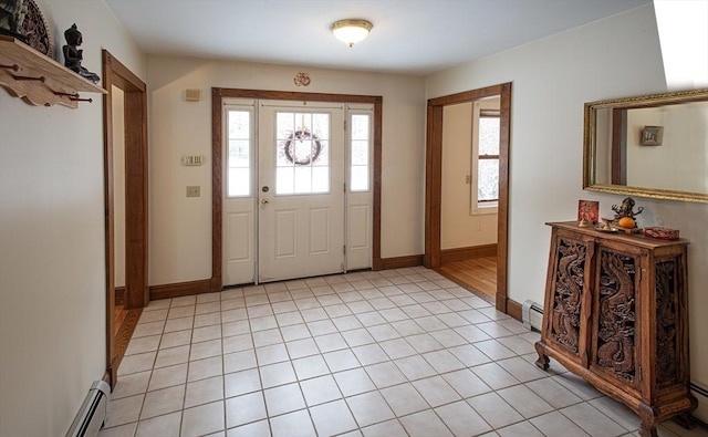 tiled foyer entrance featuring a baseboard radiator