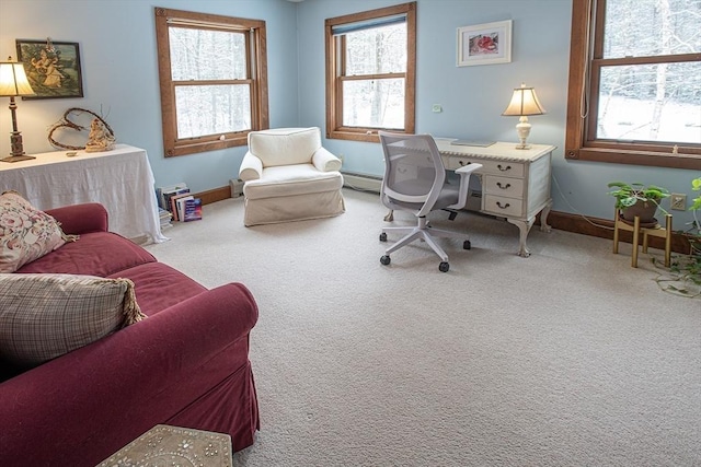 carpeted office space with a baseboard heating unit