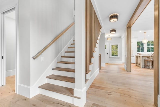 stairway with hardwood / wood-style flooring