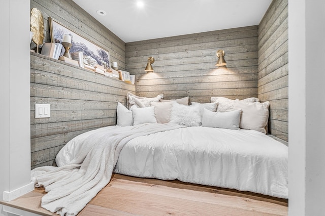 bedroom with hardwood / wood-style floors