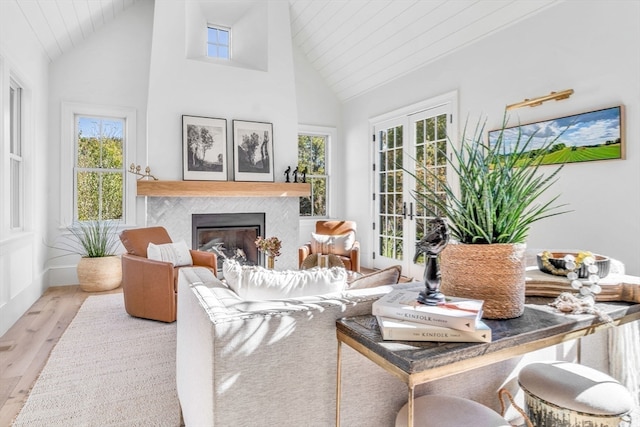 sunroom / solarium featuring lofted ceiling, a wealth of natural light, and wooden ceiling