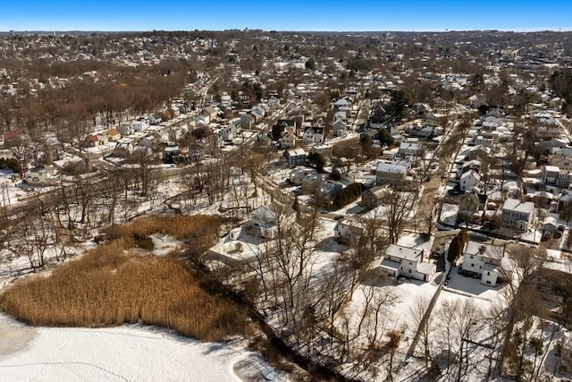 snowy aerial view with a residential view