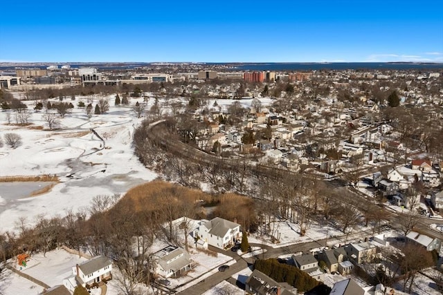 snowy aerial view featuring a residential view