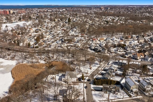 snowy aerial view with a residential view