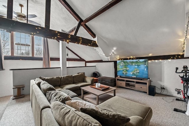 home theater with lofted ceiling with beams and carpet