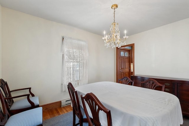 dining space with a notable chandelier, wood-type flooring, and baseboard heating