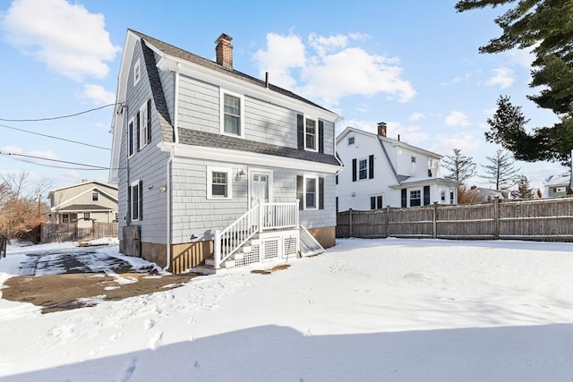 view of snow covered house