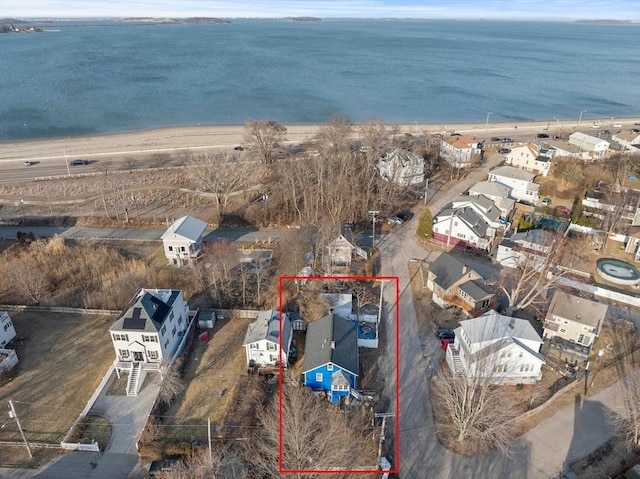 birds eye view of property featuring a water view and a residential view