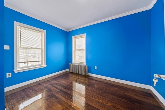 unfurnished room with baseboards, radiator heating unit, hardwood / wood-style flooring, and a healthy amount of sunlight