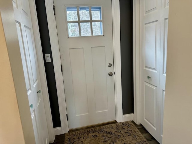 doorway to outside with dark hardwood / wood-style floors