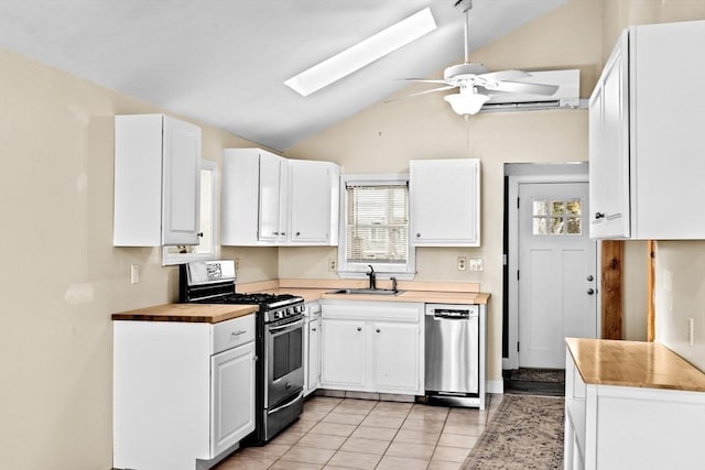 4 Morrison Way, Lakeville, MA 02347 - kitchen with appliances with stainless steel finishes, butcher block counters, a skylight, white cabinetry, and high vaulted ceiling